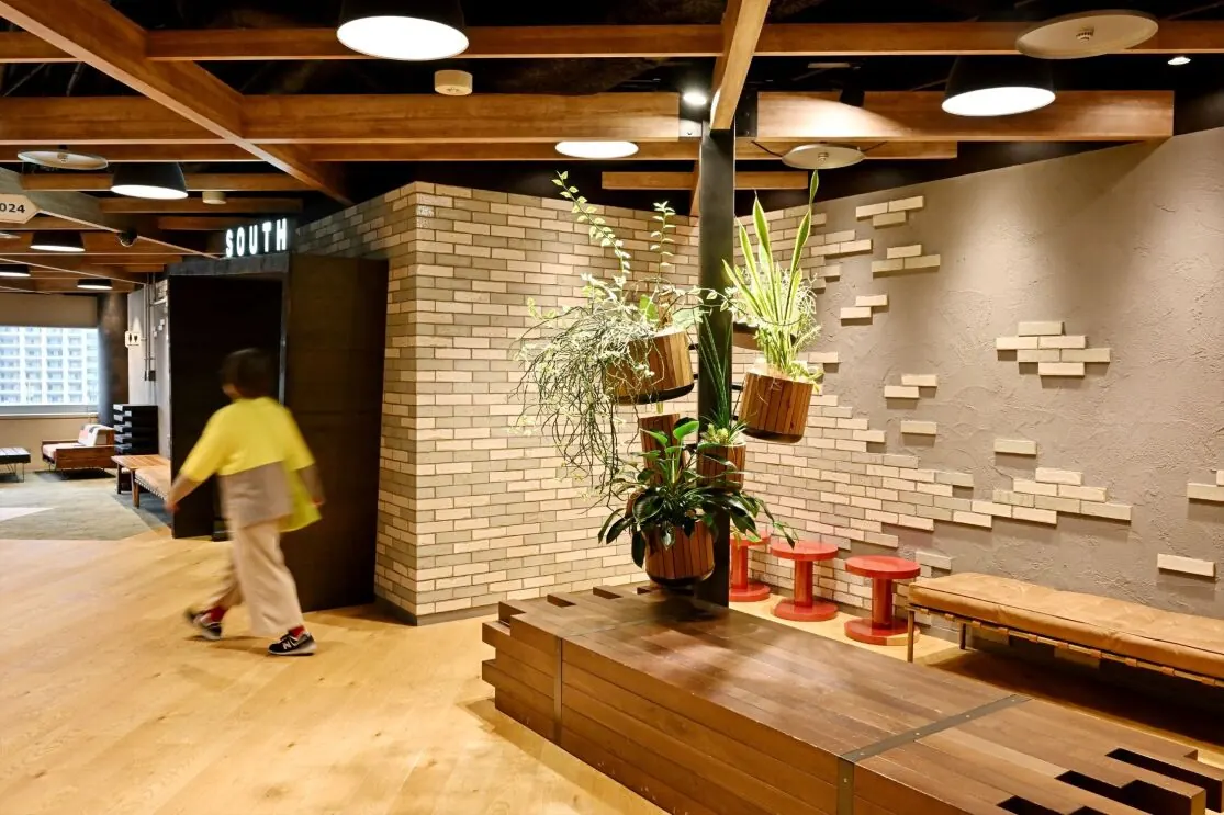 Glass-walled rooms along the corridor